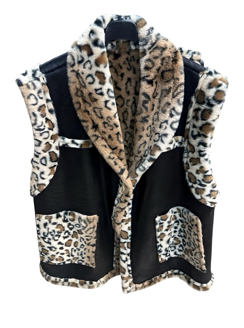 Leopard print vest over a black shirt on a white background