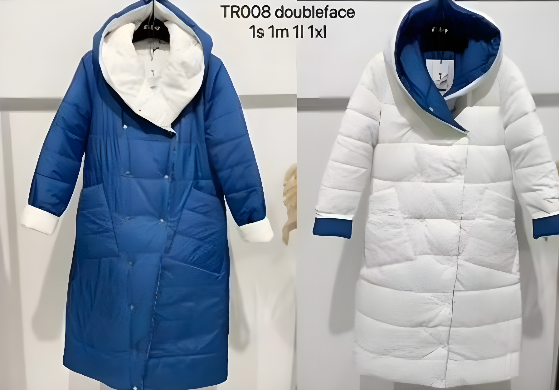 Blue and white puffer coat on a hanger with size label.